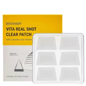 Opakowanie Meditherapy Vita Real Shot Clear Patch z sześcioma plasterkami widocznymi w przezroczystym pojemniku, na tle żółtego pudełka z informacjami o składnikach aktywnych, takich jak witamina C i niacynamid.