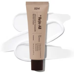Beżowa tubka Dr. Reju-All Advanced LC Ceramide Barrier Cream położona na białej rozlanej teksturze kremu.