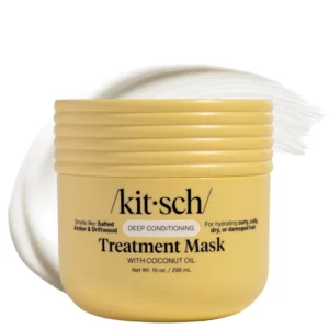 Kitsch Deep Conditioning Treatment Mask with Coconut Oil – maska do włosów w żółtym słoiku z widocznym śladem kremu w tle, kosmetyk do głębokiej pielęgnacji i regeneracji włosów suchych i zniszczonych.