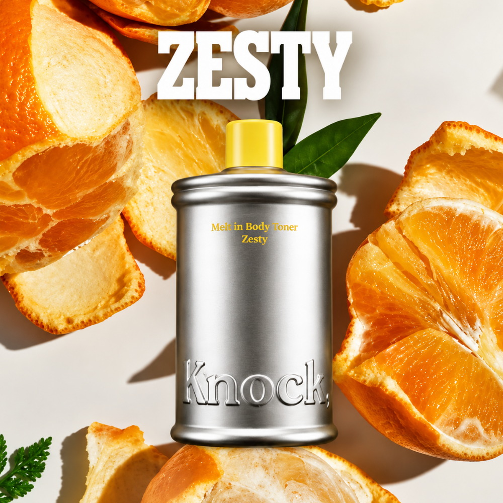 Knock Melt In Body Toner - ciało w stylu glass skin KNOCK Melt In Body Toner Zesty - tonik do ciała w srebrnym opakowaniu z żółtą nakrętką, na tle soczystych pomarańczy i skórek cytrusów.