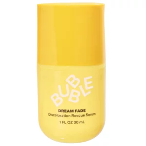 Na zdjęciu znajduje się serum Bubble Dream Fade Discoloration Rescue Serum w żółtym opakowaniu. Kosmetyk pomaga zmniejszać widoczność przebarwień, śladów potrądzikowych i nierównego kolorytu skóry.