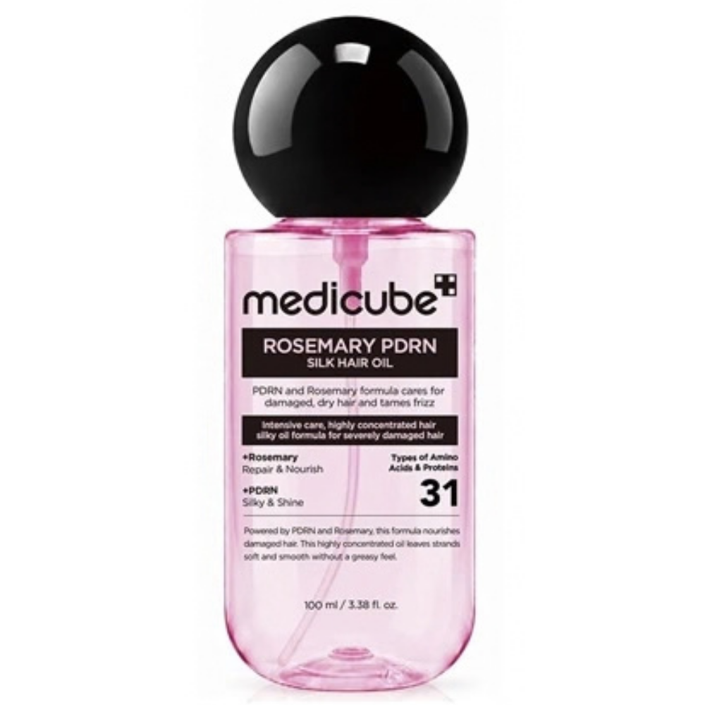 Medicube Rosemary PDRN Silk Hair Oil Olejek do włosów Medicube Rosemary PDRN Silk Hair Oil w różowej, transparentnej butelce z czarną kulistą nakrętką, 100 ml.