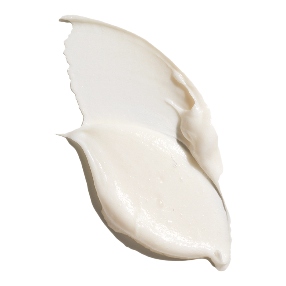 Isima Superbomba Triple Repair Peptide Mask Zbliżenie na kremową konsystencję maski isima Súperbomba, rozsmarowaną na białym tle w formie smugi.