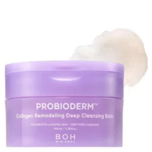 Sale 14 Zdjęcie przedstawia fioletowy słoiczek balsamu oczyszczającego Bioheal BOH Probioderm Collagen Remodeling Deep Cleansing Balm. Opakowanie zawiera różowawy balsam o kremowej konsystencji, który jest aplikowany palcami. Produkt przeznaczony jest do głębokiego oczyszczania porów i pielęgnacji skóry, poprawiając jej elastyczność. Napisy na opakowaniu podkreślają działanie wygładzające oraz efektywne oczyszczanie skóry.