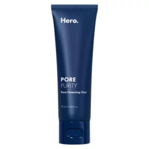 Granatowa tubka Hero Cosmetics Pore Purity™ Pore Cleansing Clay o pojemności 70 ml. Minimalistyczny design z białym logo marki i nazwą produktu na matowym tle. Produkt przeznaczony do głębokiego oczyszczania porów za pomocą glinki. Tubka posiada zamknięcie typu flip-top, które ułatwia aplikację.