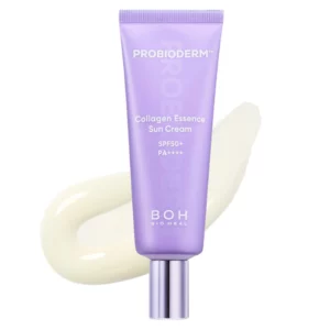 Fioletowa tubka kremu przeciwsłonecznego BOH Probioderm Collagen Essence Sun Cream SPF 50+ PA++++ z kolagenem, na tle kremowego rozsmarowanego produktu.