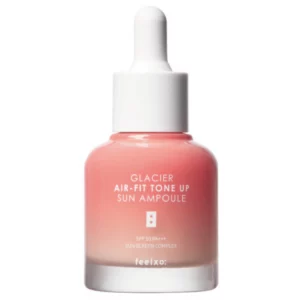 Feelxo Glacier Air-Fit Tone Up Sun Ampoule SPF 50+ – szklana butelka z pipetą, różowo-koralowy gradient opakowania, lekka ampułka przeciwsłoneczna typu tone-up na białym tle.