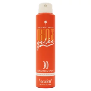 Zbliżenie na pomarańczową butelkę Vacation Orange Gelée SPF 30, elegancki design z białą nakrętką i złotym napisem. Produkt wyróżnia się na białym tle.