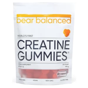 Przód opakowania Bear Balanced Creatine Gummies w białej torebce z przezroczystym okienkiem pokazującym czerwone żelki, oznaczone jako sugar-free, vegan, non-GMO, gluten-free.