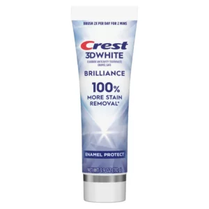 Pojedyncza tuba pasty Crest 3D White Brilliance Pro Enamel Protect na białym tle, z wyraźnym napisem „100% more stain removal” oraz informacją o ochronie szkliwa.