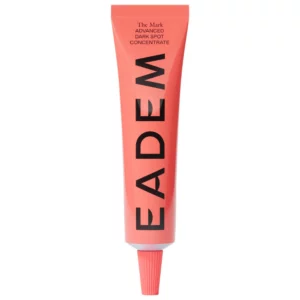 EADEM The Mark Advanced Dark Spot Concentrate – rozjaśniające serum na przebarwienia w koralowym opakowaniu typu tubka na jasnym tle.