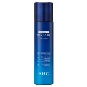 Na zdjęciu widoczny jest flakon AHC Premium EX Hydra B5 Emulsion na jasnym tle. Minimalistyczny design podkreśla nowoczesny, profesjonalny charakter produktu.