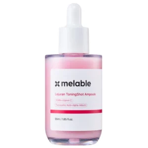 Na zdjęciu widoczna jest butelka Melable Lejuran ToningShot Ampoule z pipetą na białym tle. Minimalistyczne opakowanie i delikatny różowy odcień formuły podkreślają nowoczesny charakter produktu.