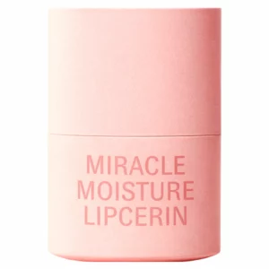 Minimalistyczne ujęcie O HUI Miracle Moisture Lipcerin na jasnym tle. Cylindryczne, matowe opakowanie w odcieniu pudrowego różu z napisem „Miracle Moisture Lipcerin” w tonalnym kolorze.