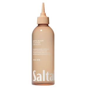 Santal Bloom In-Shower Hair Gloss – butelka produktu na jasnym tle, minimalistyczne ujęcie.