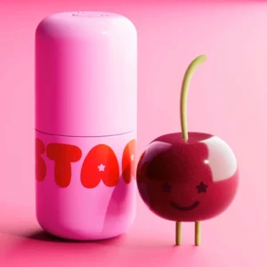 Balsam do ust Starface Star Balm w różowym opakowaniu obok stylizowanej wiśni na pastelowym tle.