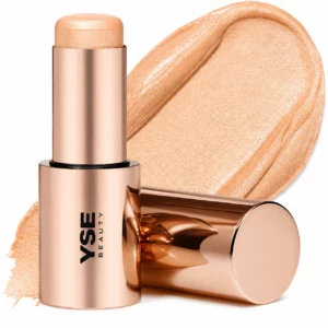 Luksusowy rozświetlacz w sztyfcie YSE Beauty na białym tle – glow stick do makijażu z połyskującą złoto-beżową formułą, efekt glass skin, kremowy highlighter premium do twarzy, bestseller beaut