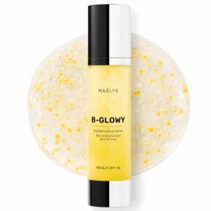 body 6 Serum rozświetlające do ciała MAËLYS B-GLOWY w żółtej butelce 100 ml, na tle zbliżenia transparentnej żelowej konsystencji z żółtymi drobinkami.