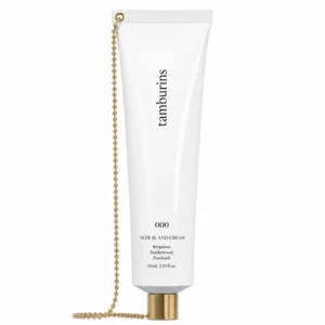 Krem do rąk Tamburins Nude H. And Cream 000 przedstawiony frontem na białym tle. Biała tuba z minimalistycznym logo marki, złotą zakrętką oraz charakterystycznym złotym łańcuszkiem podkreśla luksusowy i nowoczesny charakter produktu.