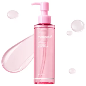 Medicube PDRN Mild Cleansing Oil – różowa butelka olejku oczyszczającego z pompką na białym tle, otoczona kroplami transparentnej formuły.