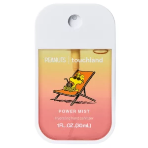 Na zdjęciu znajduje się Peanuts x Touchland Beach Coco Power Mist 30 ml w limitowanym opakowaniu z grafiką Woodstocka, pokazany frontem na białym tle.