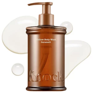 body 13 KNOCK Mellow Body Wash Caramelt 300 ml – karmelowy żel do mycia ciała w bursztynowej butelce z pompką na białym tle.