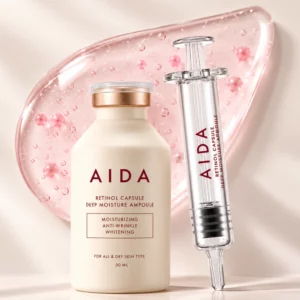 Start 46 AIDA Retinol Capsule Deep Moisture Ampoule - ampułka z retinolem w kapsułkach na tle różowej kropli, z precyzyjnym aplikatorem.